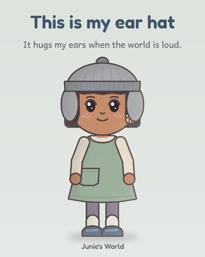 Junie wears her soft gray knit ear hat with long flaps that cover her ears.